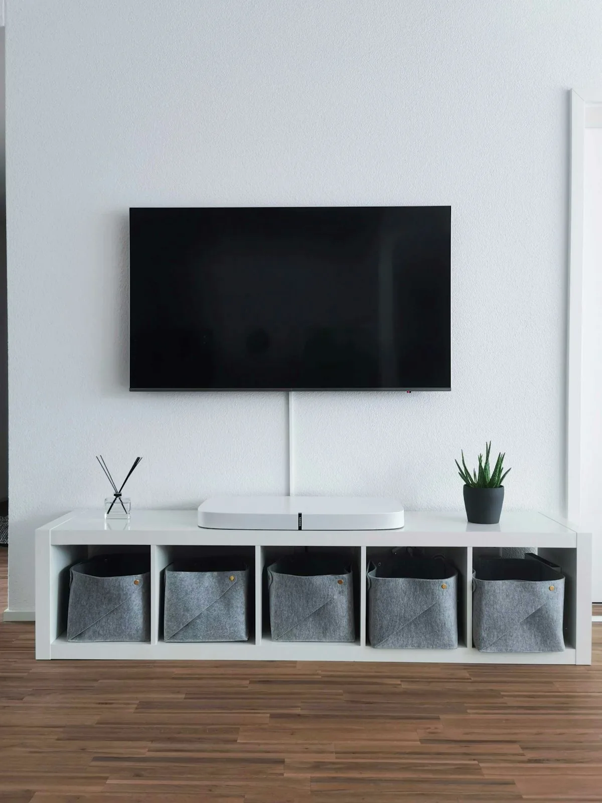 Multiple TVs on display wall showing different technologies