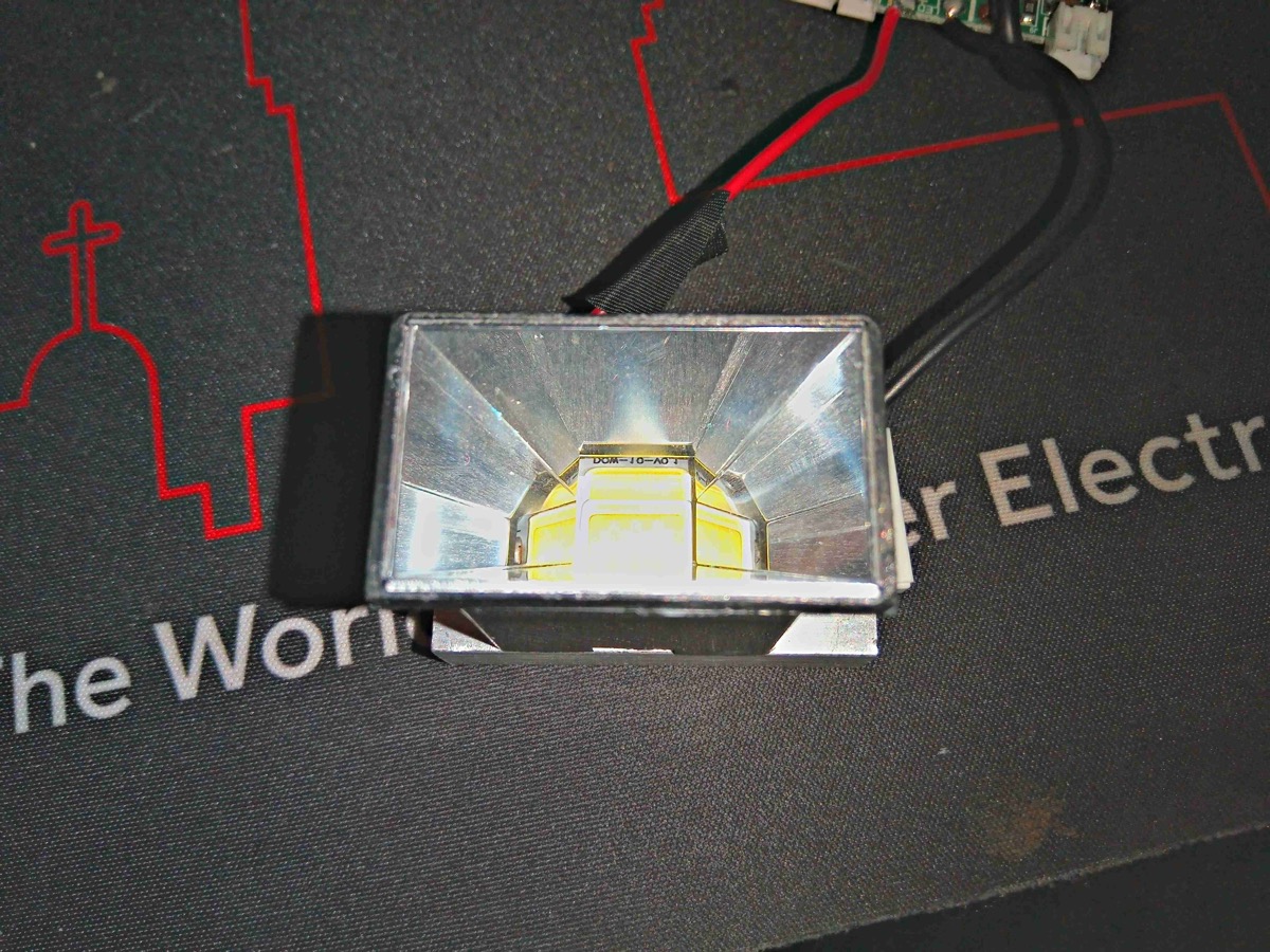 LED module with reflector housing inside a projector